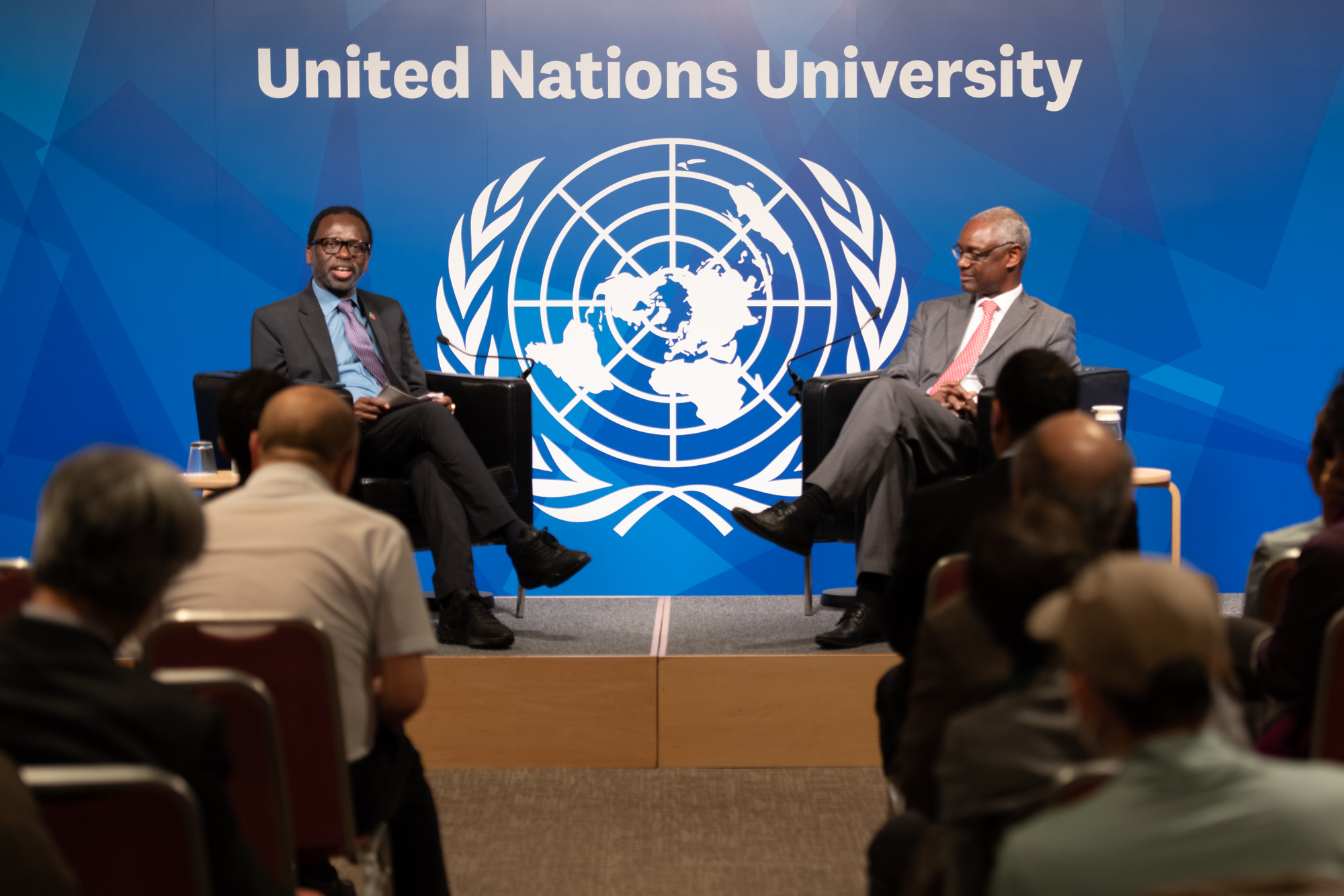Mr. Ibrahim Thiaw and Prof. Tshilidzi Marwala in a conversation with the audience, exploring the relationship between land degradation and human security
