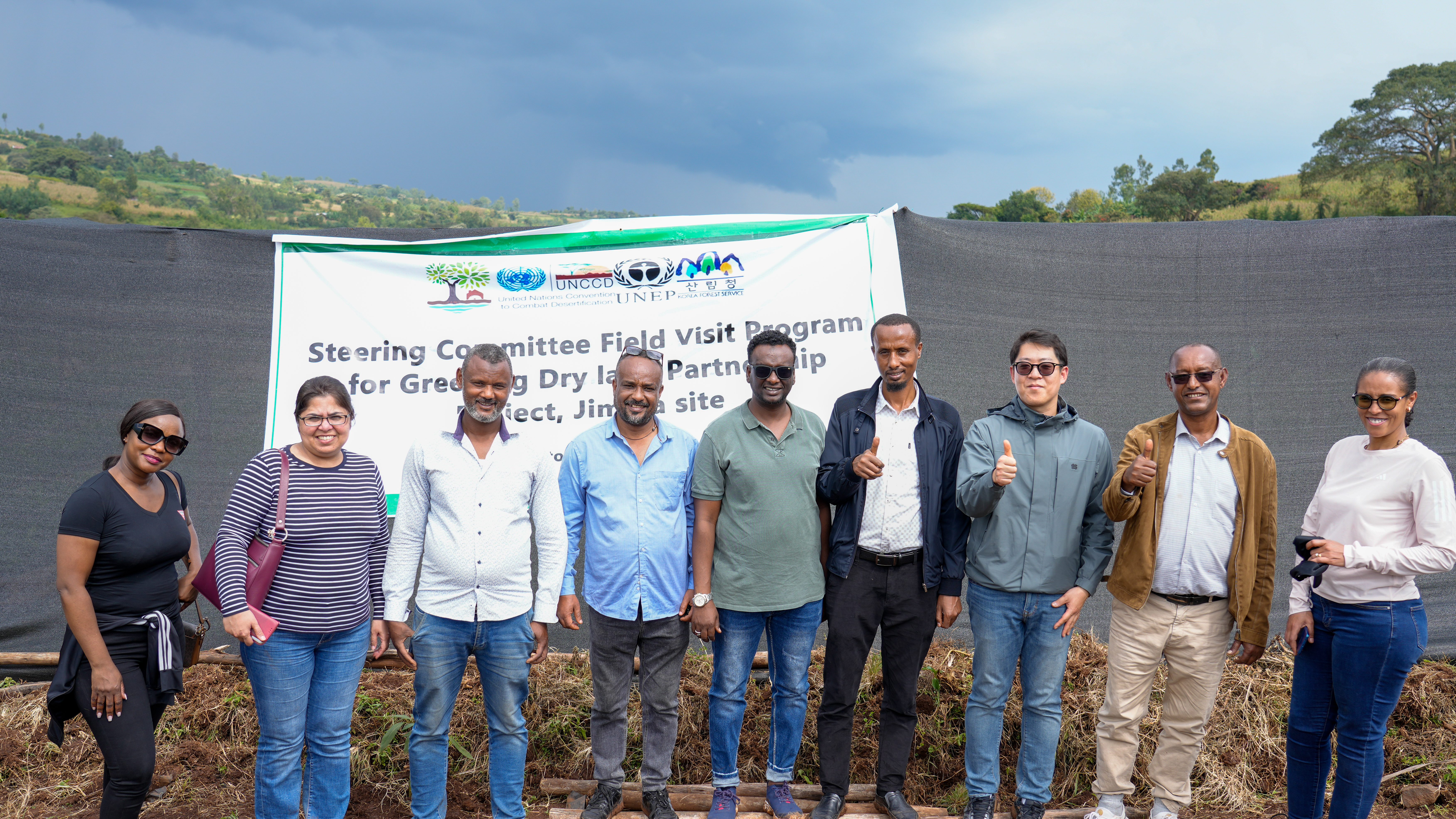 Group photo of the Steering Committee, including members from UNCCD, UNEP, and local experts, during a field visit for the Greening Drylands Partnership project in Jimma, Ethiopia.